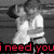 Black-and-white image of two figures with red text overlay reading "i need you to see me the way i see you" in pixelated font.