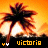 Pixelated sunset scene with palm tree silhouette, orange sky gradient, and text 'victorio' below.