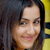 Static 50x50 pixel icon showing a close-up of a person's face with long dark hair against a yellow background, rendered in low-resolution pixel art style.