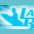Pixelated blue and white graphic featuring the text "LAGUNA BEACH" with a stylized wave icon on left, set against light blue background.