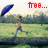 Pixelated image of a person running on grass with arms raised, holding a blue umbrella, against a blurred background and red text above.