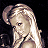 Pixelated static image of a person with light-colored hair in a side profile pose against a dark background, rendered at 48x48 pixels with visible dithering and anti-aliasing effects.