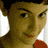 nine pixelated images showing a person with dark hair, red lips, and large white earrings against a light background
