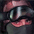 Pixelated image of a person wearing dark goggles and a red cap, with green text reading 'Original Icons .com' on the right side.