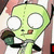 Green cartoon alien with large white eyes and brown cheeks holds a microphone, standing against striped background.