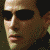 six identical pixelated images showing a person with dark hair, black sunglasses, and a neutral expression against a muted brown background