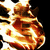 A pixelated static image of a stylized character with a large head, glowing eyes, and a fiery orange and yellow color scheme against a black background.