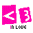 Pixelated pink icon with white left-pointing arrow and '3' symbol, displaying "in Love" text below in black letters.