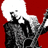 Pixelated figure in dark clothing with raised arm against red background, white speech bubble above head.