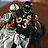 Pixelated image of two figures in baseball uniforms embracing on a brown background, with orange text reading "Devin Hester You Are Ridiculous!!!" on blue.
