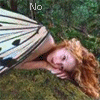 A woman with long red hair lies on green grass, her head resting on a large butterfly wing; text changes across frames.