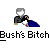 Pixelated character with gray hair and white face in black suit, red tie, blue cape, holding white object, text below reads "Bush's Bitch".