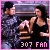 Two figures in a gym setting with one lifting weights, pink border, and pixelated text reading '307 FAN' at the bottom.