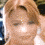 A pixelated image of a person with light brown hair in three sequential views showing head movement and facial expression changes.