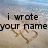 A beach scene with text overlaid on sand, showing a heart drawn in the sand and waves washing over it.