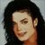 Static pixelated image of a person with long dark hair and light skin, cropped to show head and shoulders against a gray background.