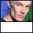 20 pixelated frames showing a person with short light hair against alternating green and blue backgrounds, text evolving from 'S' to 'Spike is so HOT!' in the lower