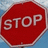 A red octagonal stop sign with white text 'STOP' on the left, and a modified version of the same sign with overlaid black-and-white pixelated text blocks on the right.