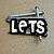 A pixelated icon with a hammer and anvil, featuring text elements 'LETS' and 'get' above the anvil.