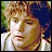 Pixelated image of a character with curly blonde hair and white clothing, next to 'LORD OF THE RINGS THE TWO TOWERS' text on black background.