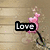 A four- of pixelated icons with text overlays: a pink flower on wood, a heart-shaped nebula, and two purple designs