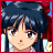 Pixelated anime-style character with dark blue hair and red hair accessory, next to black background with white text.