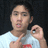 A person in a white shirt with red text makes hand gestures against a dark background, with purple text reading "TEEHEE" visible on one frame.
