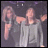 Two side-by-side pixelated images of a person with light brown hair wearing a gray long-sleeve shirt, one with arms raised and the other with arms crossed.