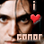 A 49x49 pixel animated contact sheet showing two frames of a buddy icon featuring a close-up face with text and heart symbols, where the left frame has a red heart and "conor" text while the right frame shows a white heart and "oberst" text.
