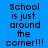 Blue background with repeated black pixelated text reading "School is just around the corner!!!" in two vertical