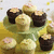 cupcakes on a yellow surface with a light background, showing subtle pixel variations between frames