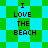 Pixelated text "I LOVE THE BEACH" appears on a green and cyan checkered background with diamond-shaped green