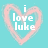 A static pixelated icon with a light blue background, pink heart outline, and white text reading "i love luke" centered inside the heart.