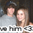 Two people stand close together in a pixelated image with text overlay reading 'love him <3' at the bottom.