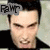 Pixelated close-up of a person with dark hair and light skin wearing black clothing, with partial text 'RAT' visible in the top-left corner.