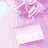Animated sequence showing a person with pink hair and tattoos holding flowers, transitioning from a wrapped package to the figure.
