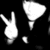 White pixelated shapes on black background: a hand with extended index and middle fingers, a large triangular shape, and a small crescent shape.