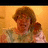 Pixelated image of a person with light brown hair in a room, next to blue background text reading WHAT WOULD YOU LIKE FOR BREAKFAST JOHNNY MUFFINS !!!! Gunningham MUFFINS <8.