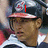 A person wearing a dark helmet with red brim and white-and-blue striped shirt appears in four with red text overlays