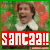 A pixelated image of a person in an elf costume with green and red background, featuring text reading 'SANTA?!' on a colored banner below.