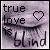 A pixelated image with text 'true love is blind' and a heart symbol that changes from solid to outline between frames.