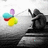 A grayscale figure sits on a bench holding a fishing rod with colorful balloons floating nearby.