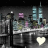 Pixelated cityscape with tall buildings and street lamps, featuring a heart symbol that changes color across frames.
