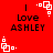 Red background with black text reading "Love ASHLEY" and white pixelated square patterns in four corners.
