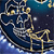 A pixelated static image shows a golden robot figure standing on a dark blue platform with white and yellow accents against a dark blue background.