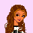 Pixel art of a character with long brown hair and an orange face, wearing a white shirt with black text and beige pants, displayed on pink and green backgrounds.