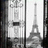 Static grayscale image showing a stylized Eiffel Tower on the right and abstract vertical patterns with dark rectangular elements on the left.