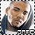 Pixelated static icon of a person with light skin tone wearing dark clothing, framed by black-and-white striped border with "GAME" text at bottom.