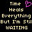 Pixelated text reads 'Time Heals Everything But I'm Still WAITING' with a pink heart symbol above the right-side text block on black background.