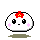 A 4-frame pixel art animation of a white rounded character with pink cheeks, black eyes, and a red flower on its head, displayed in a 2x2 contact sheet against a gray background.